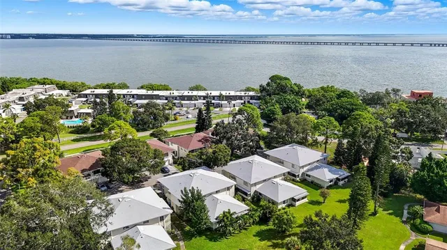 an aerial view of a house with a lake view