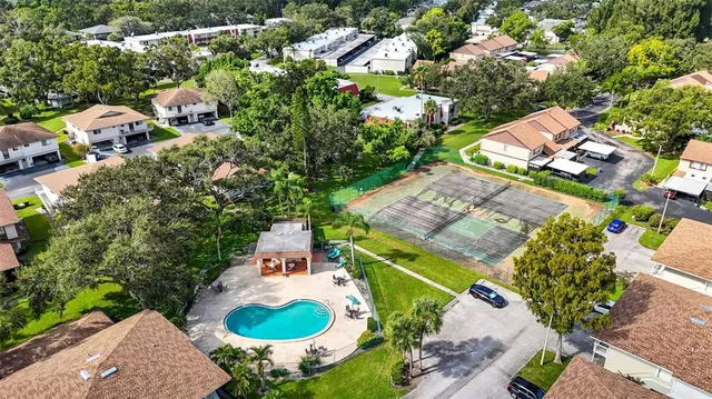an aerial view of residential houses with outdoor space