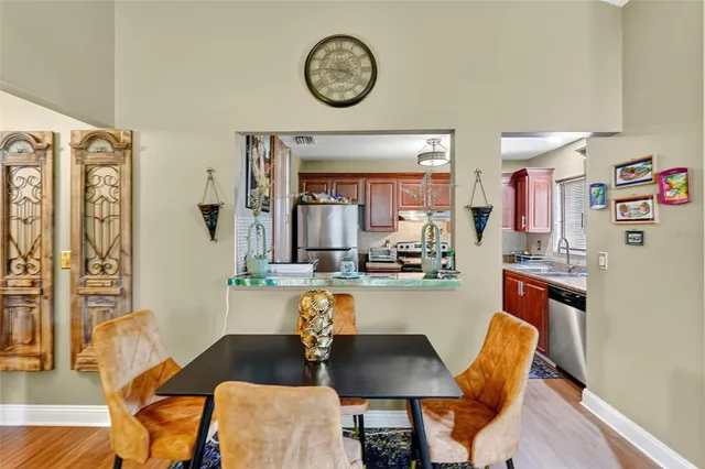 a dining room with furniture and a clock