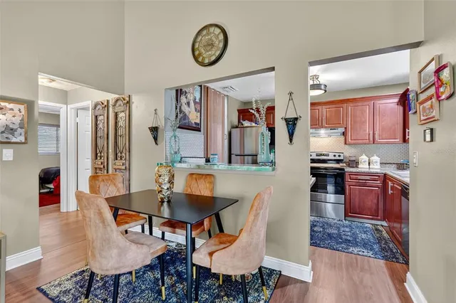 a living room with furniture a rug and a clock