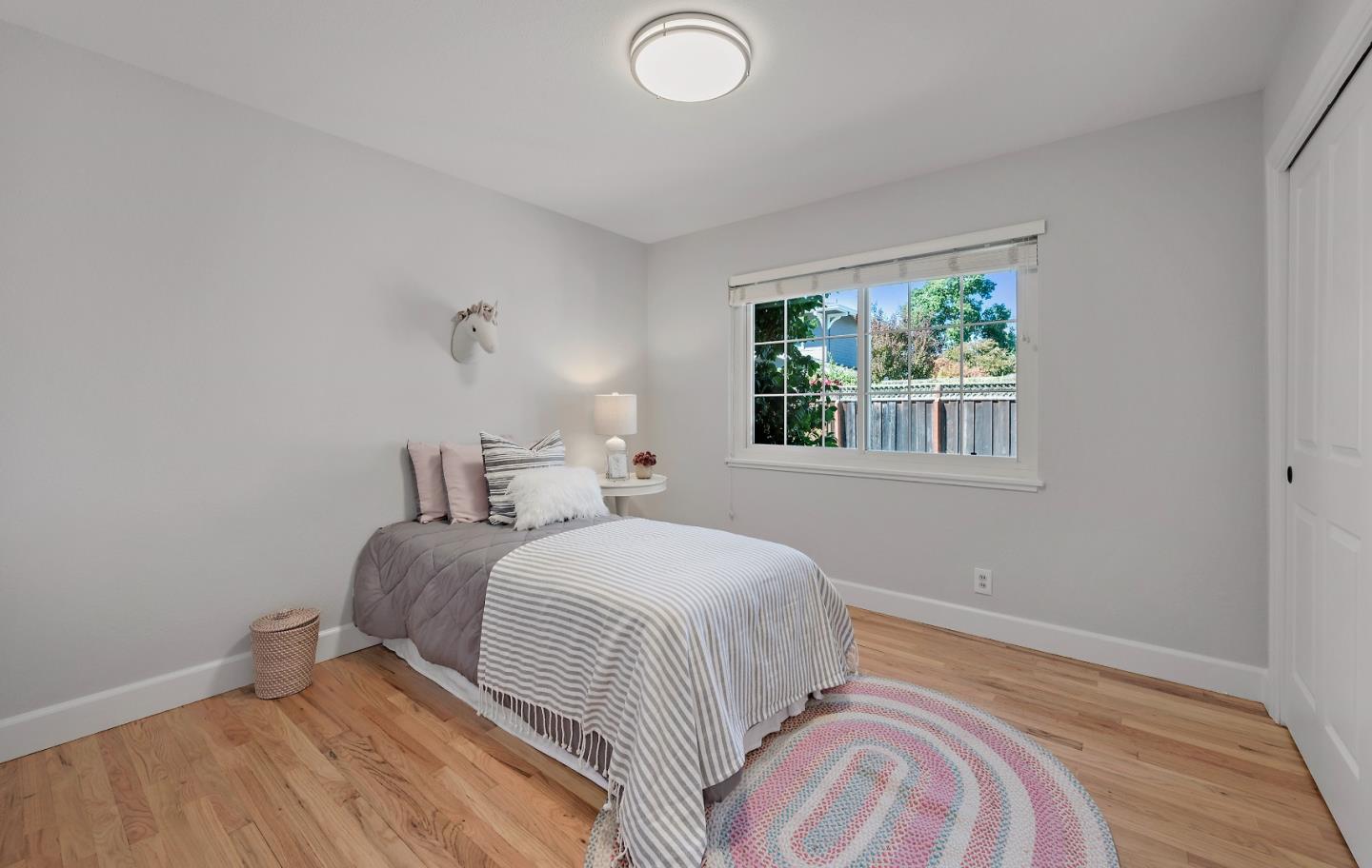 16131 Jacaranda Way Los Gatos, CA 95032 - Photo 20 of 30 a bedroom with a bed and a window