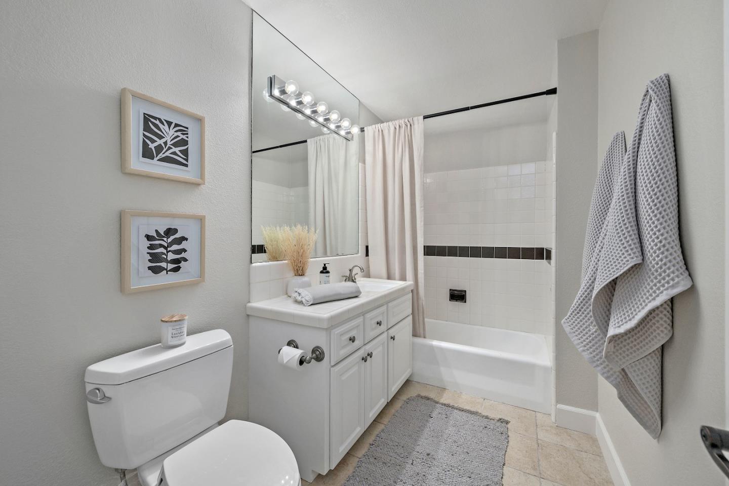 16131 Jacaranda Way Los Gatos, CA 95032 - Photo 22 of 30 a bathroom with a toilet sink and a mirror