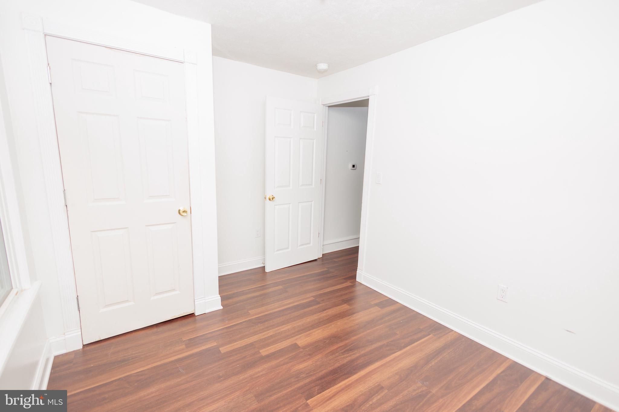 130 State Street Glassboro, NJ 08028 - Photo 8 of 17 a view of an empty room with wooden floor