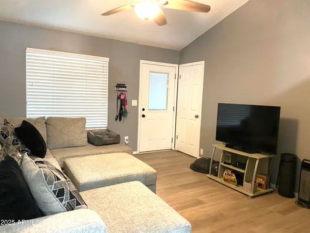 a living room with a flat screen tv and a couch
