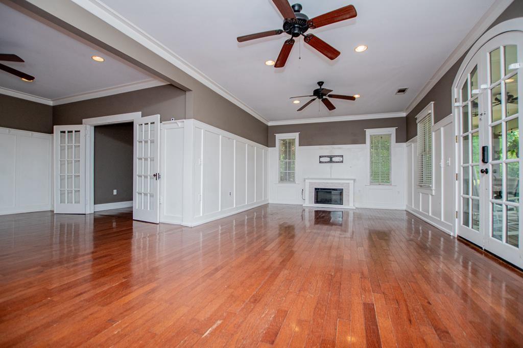 75 Cash Lane Bremen, GA 30110 - Photo 18 of 92 a view of a livingroom with wooden floor a ceiling fan and kitchen space