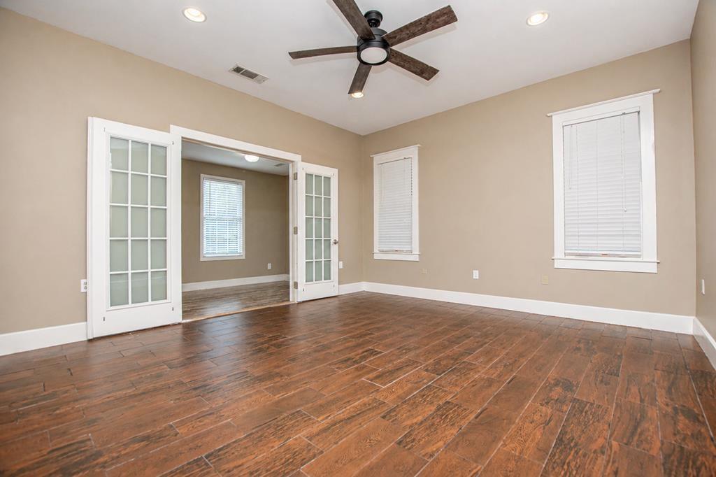 75 Cash Lane Bremen, GA 30110 - Photo 20 of 92 a view of an empty room with wooden floor and a window