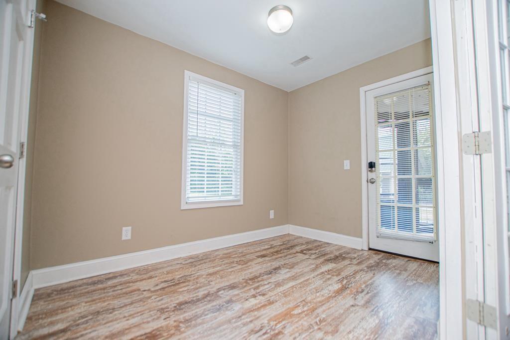 75 Cash Lane Bremen, GA 30110 - Photo 39 of 92 an empty room with wooden floor and windows