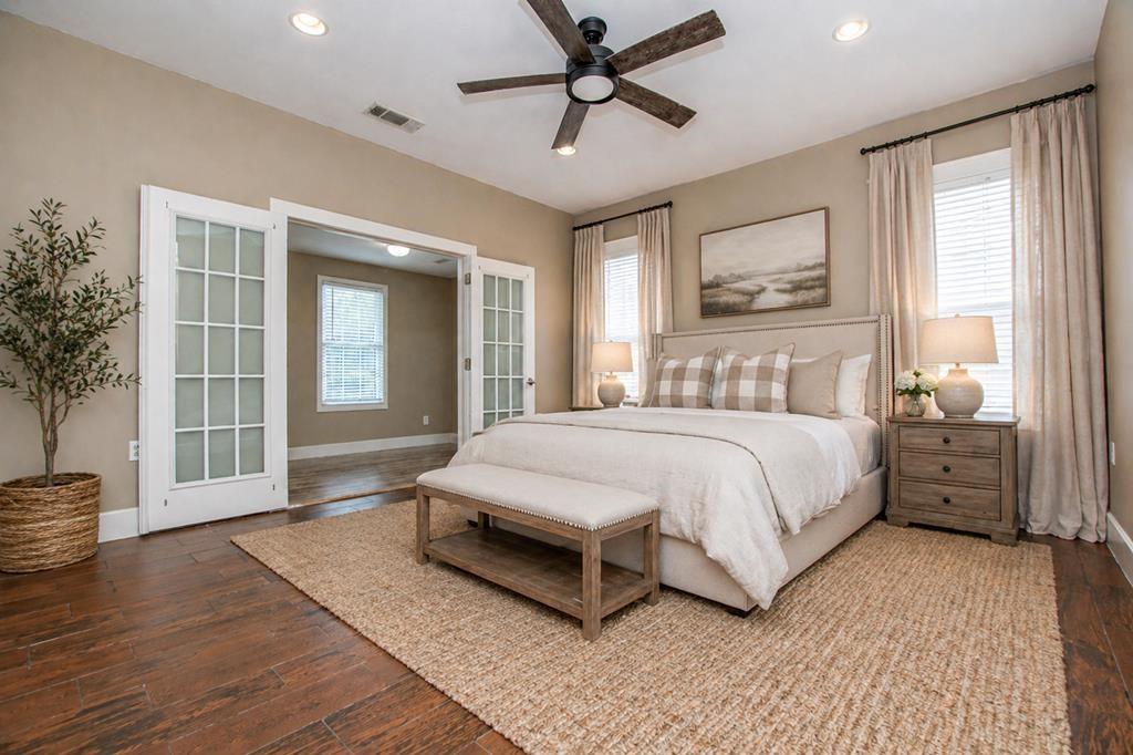 75 Cash Lane Bremen, GA 30110 - Photo 54 of 92 a bedroom with a large bed and wooden floor