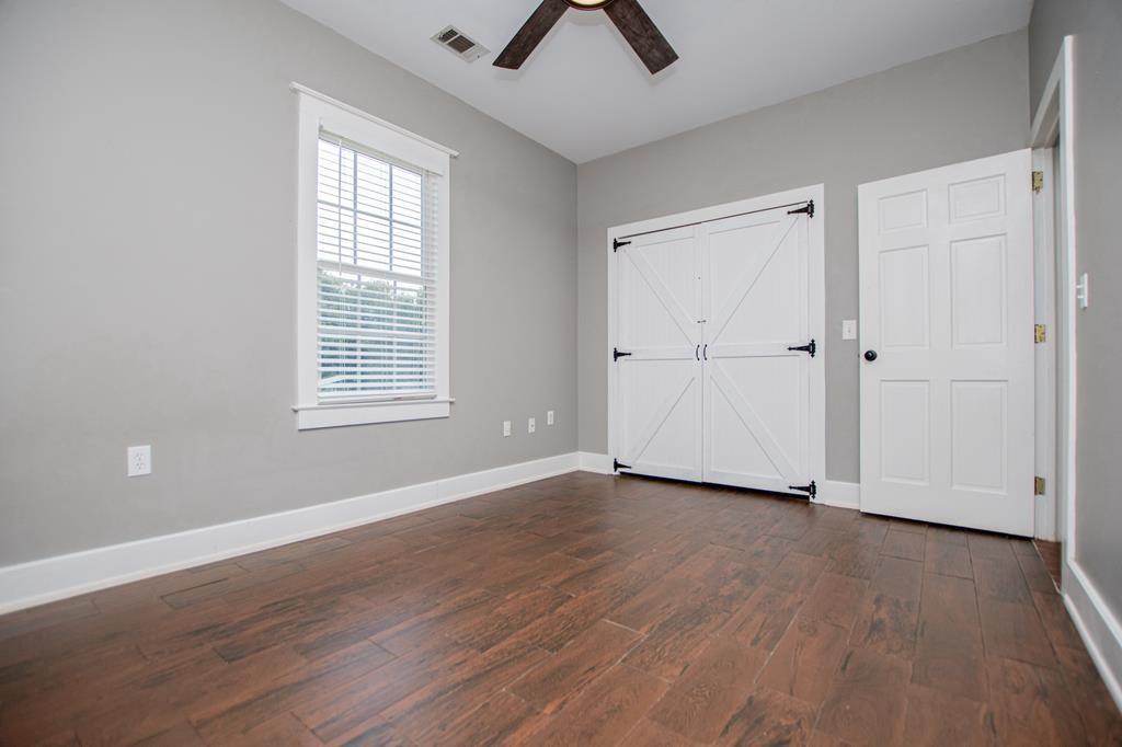 75 Cash Lane Bremen, GA 30110 - Photo 56 of 92 an empty room with wooden floor closet and windows