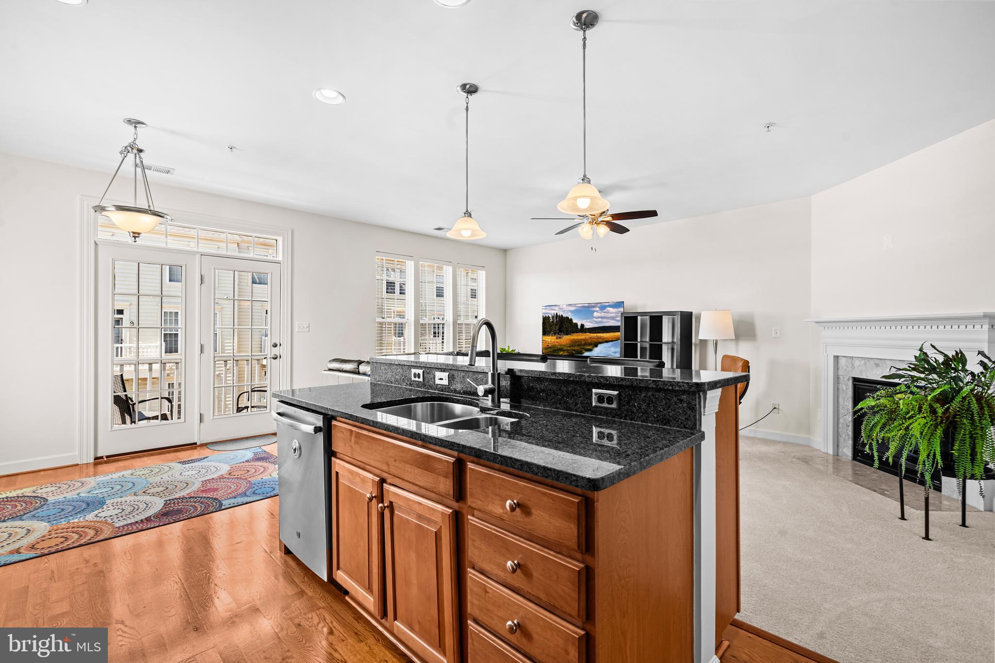 5725 Callcott Way, Unit P Alexandria, VA 22312 - Photo 15 of 40 a kitchen with stainless steel appliances granite countertop a stove a sink and a refrigerator
