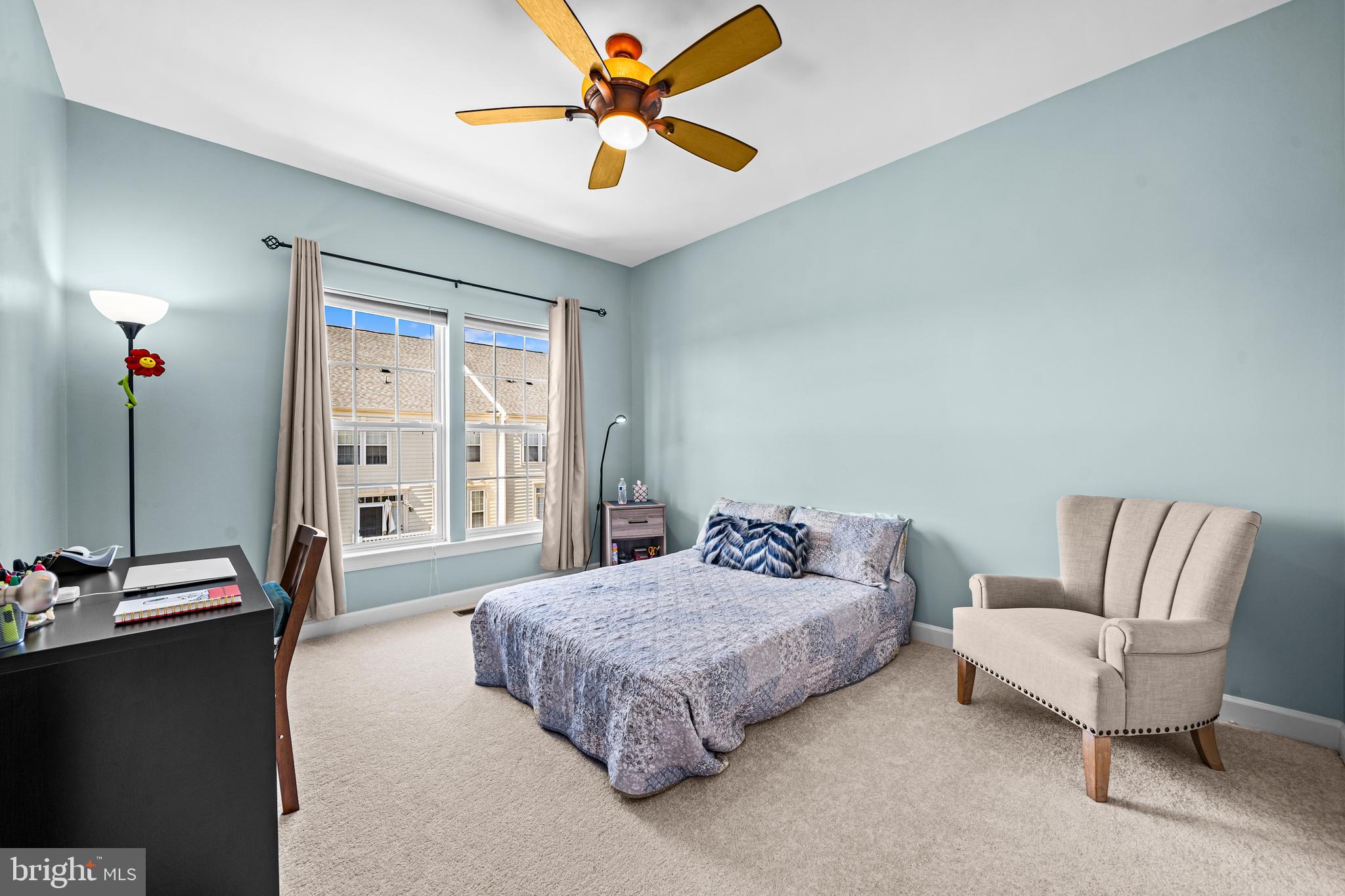 5725 Callcott Way, Unit P Alexandria, VA 22312 - Photo 29 of 40 a spacious bedroom with a bed and a chandelier
