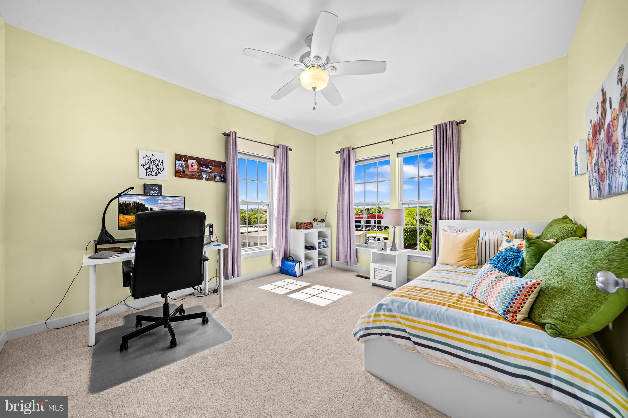5725 Callcott Way, Unit P Alexandria, VA 22312 - Photo 32 of 40 a bedroom with a bed and a chandelier