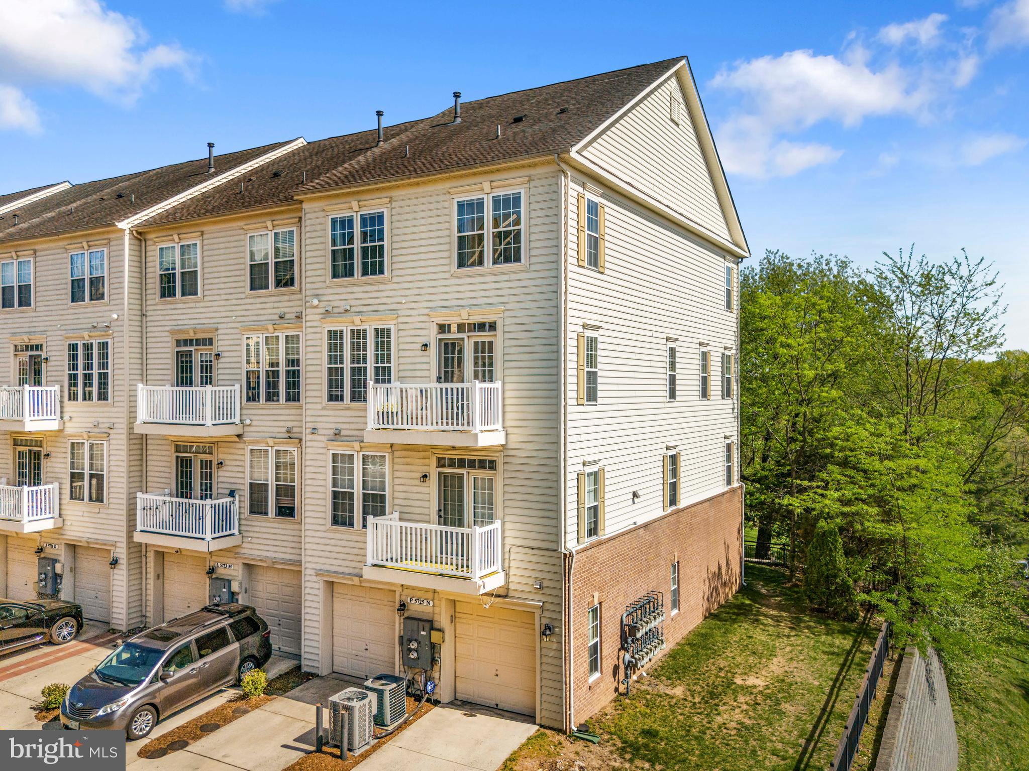 5725 Callcott Way, Unit P Alexandria, VA 22312 - Photo 37 of 40 a front view of a house with a yard