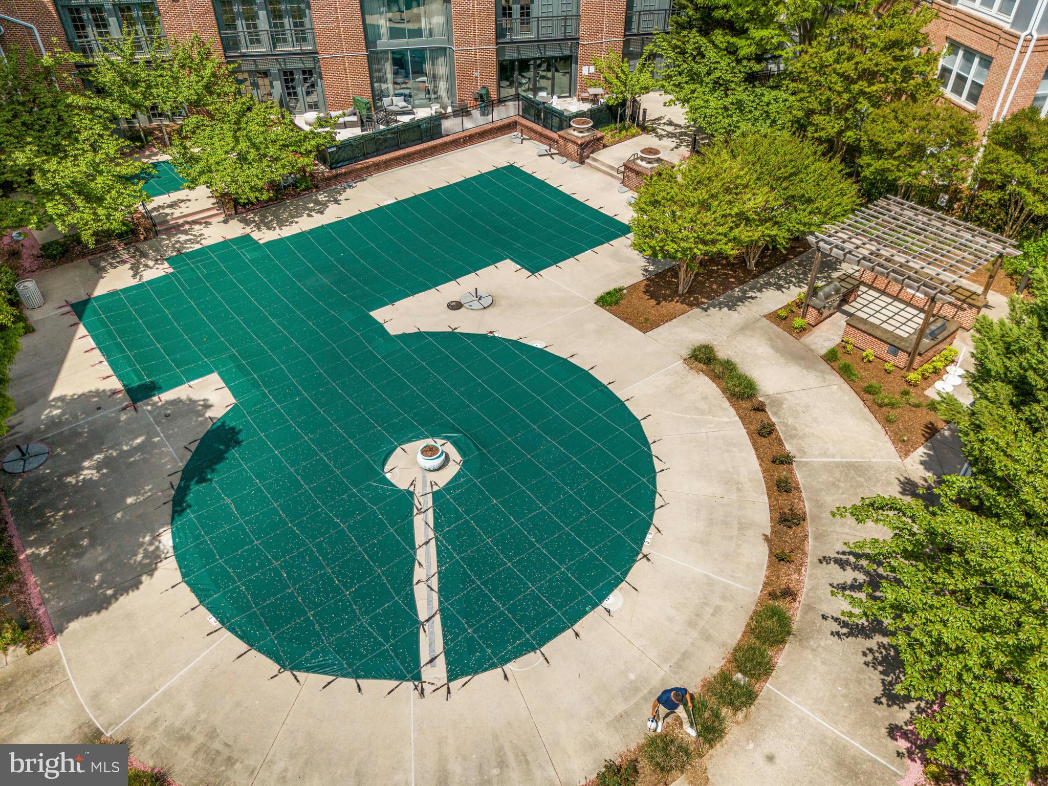 5725 Callcott Way, Unit P Alexandria, VA 22312 - Photo 39 of 40 a view of a swimming pool with a sitting area