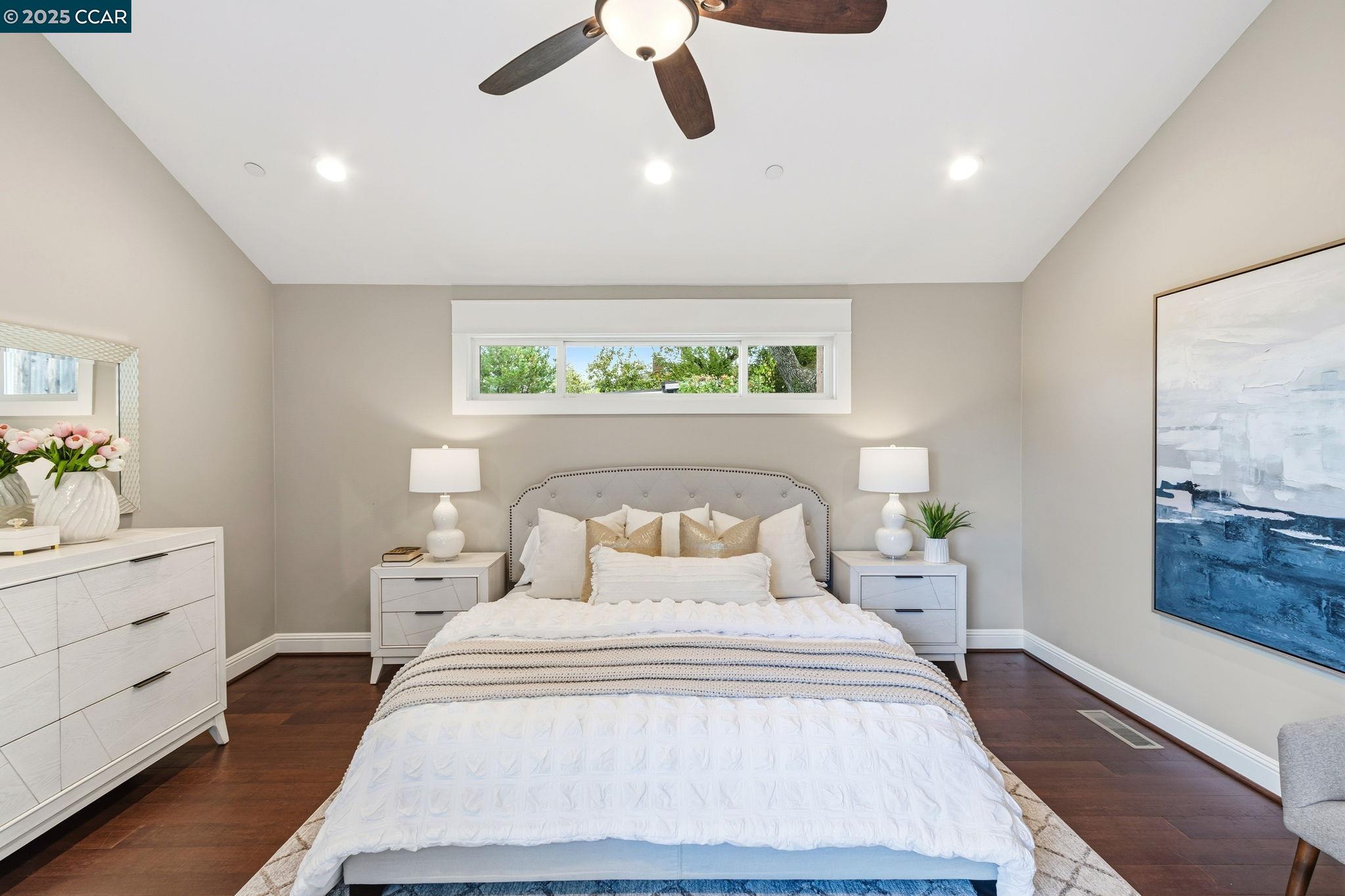 961 Oak View Circle Lafayette, CA 94549 - Photo 25 of 56 a bedroom with a large bed and a chandelier