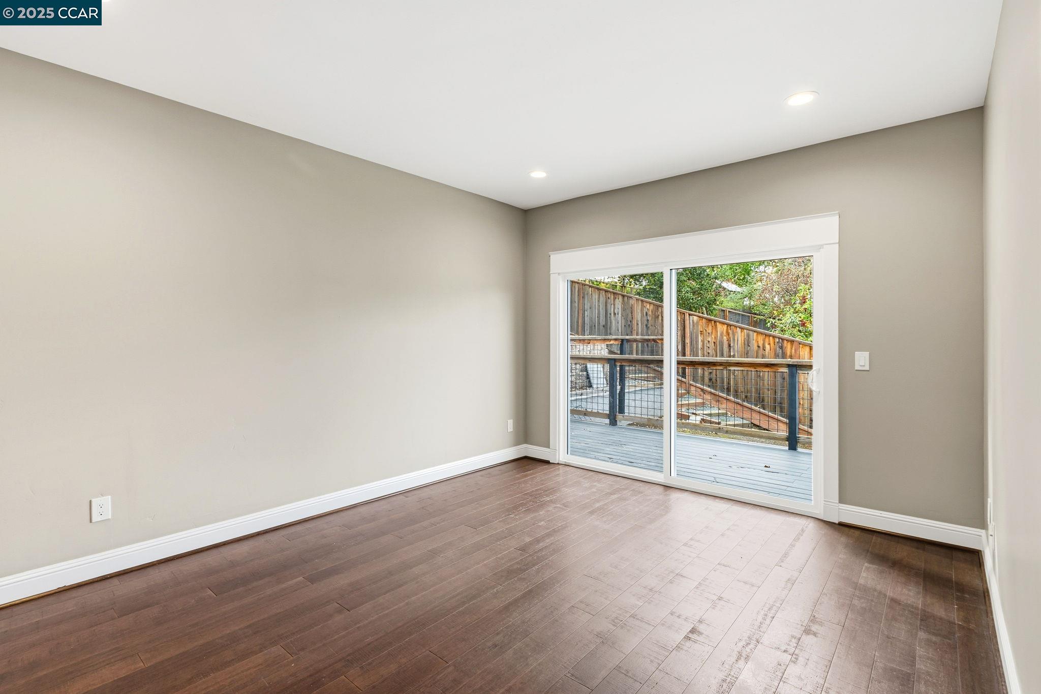961 Oak View Circle Lafayette, CA 94549 - Photo 31 of 56 a view of an empty room with wooden floor and a window