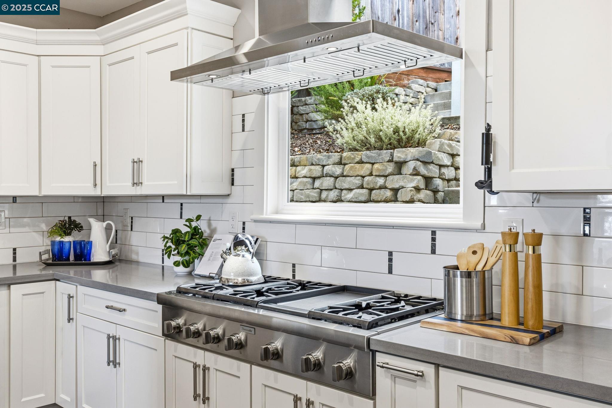 961 Oak View Circle Lafayette, CA 94549 - Photo 52 of 56 a kitchen with stainless steel appliances granite countertop a stove a white cabinets and a window