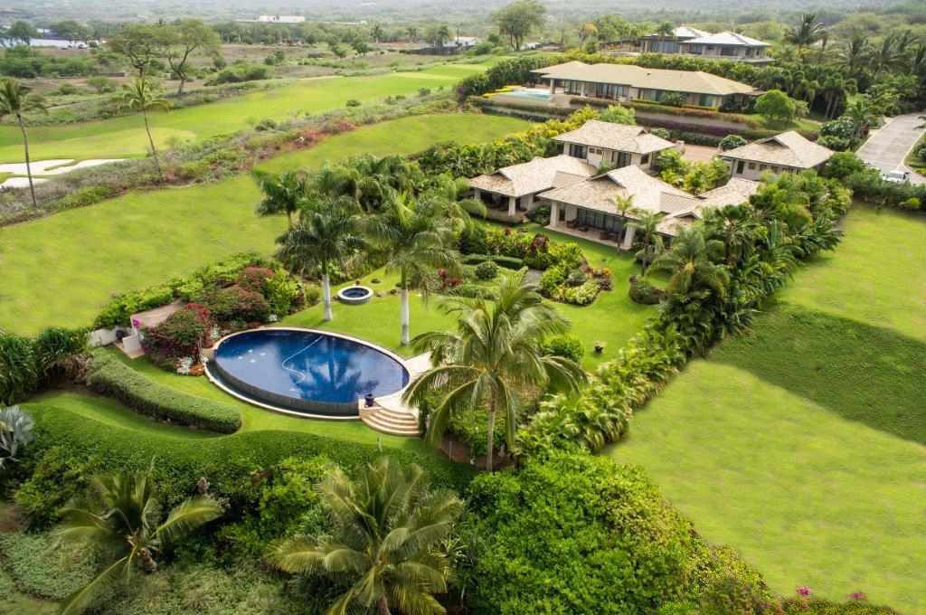 5520 Makena Road Kihei, HI 96753 - Photo 2 of 2 an aerial view of residential houses with outdoor space and swimming pool
