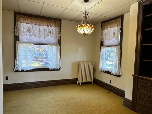 a view of a windows and chandelier in a room