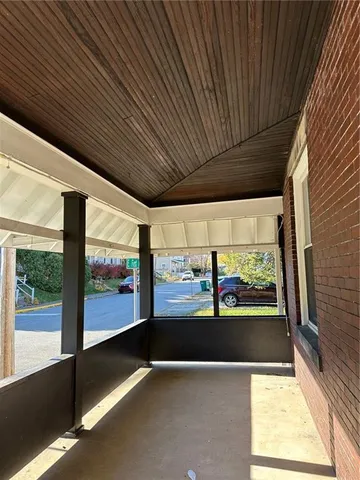 a view of an empty room with a large window