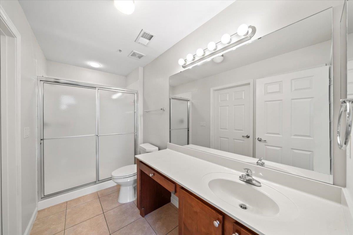 8897 Parkview Oaks Circle Olive Branch, MS 38654 - Photo 15 of 31 a bathroom with a double vanity sink mirror and shower