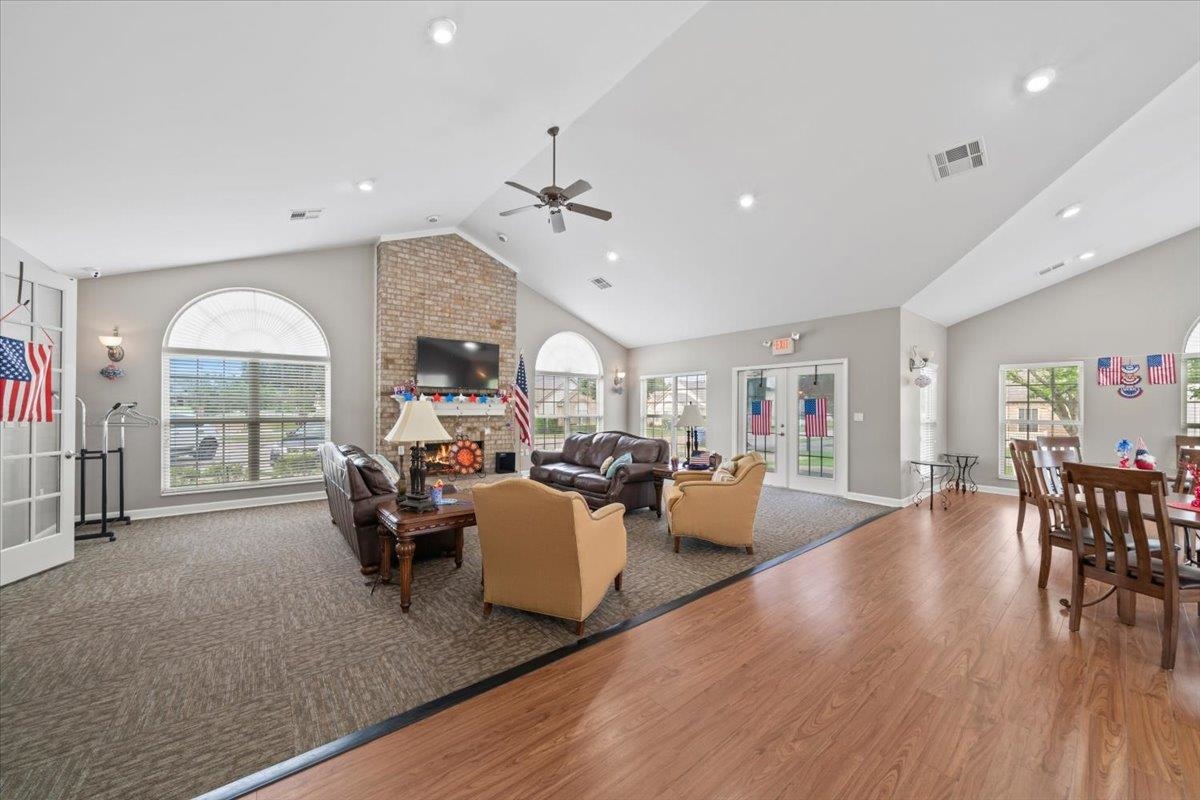 8897 Parkview Oaks Circle Olive Branch, MS 38654 - Photo 28 of 31 a living room with fireplace furniture and a wooden floor