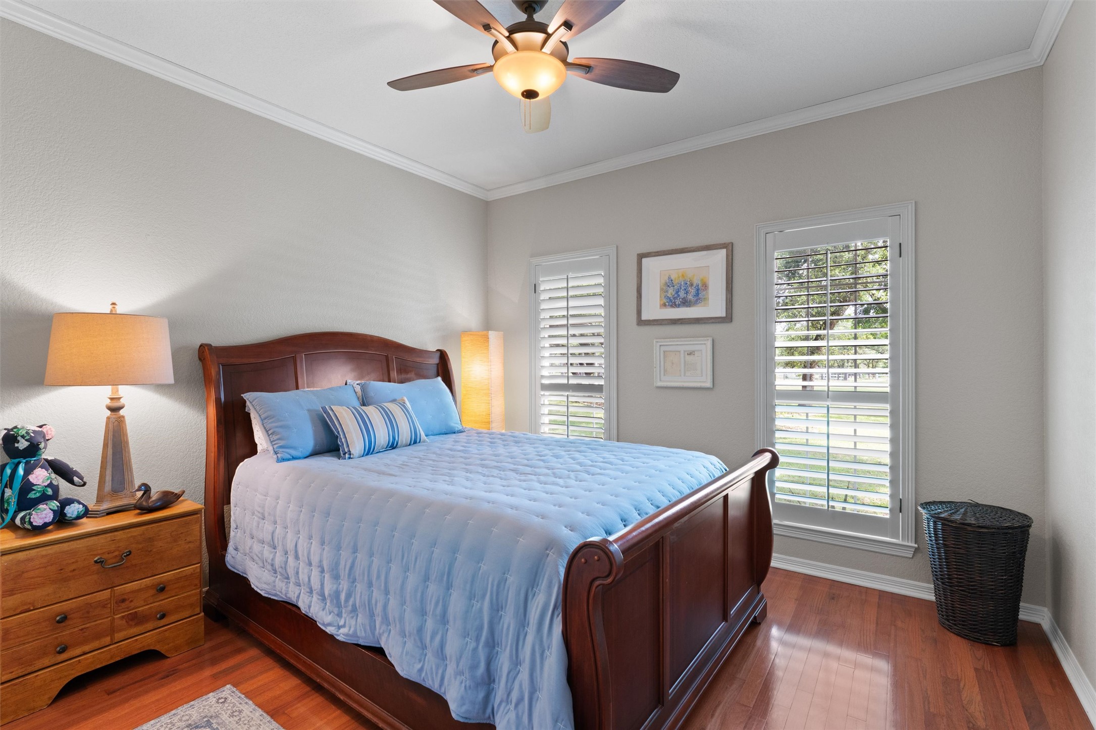 223 East Ridgewood Road Georgetown, TX 78633 - Photo 19 of 40 Hardwood floors and a ceiling fan create a comfortable atmosphere in the secondary bedroom