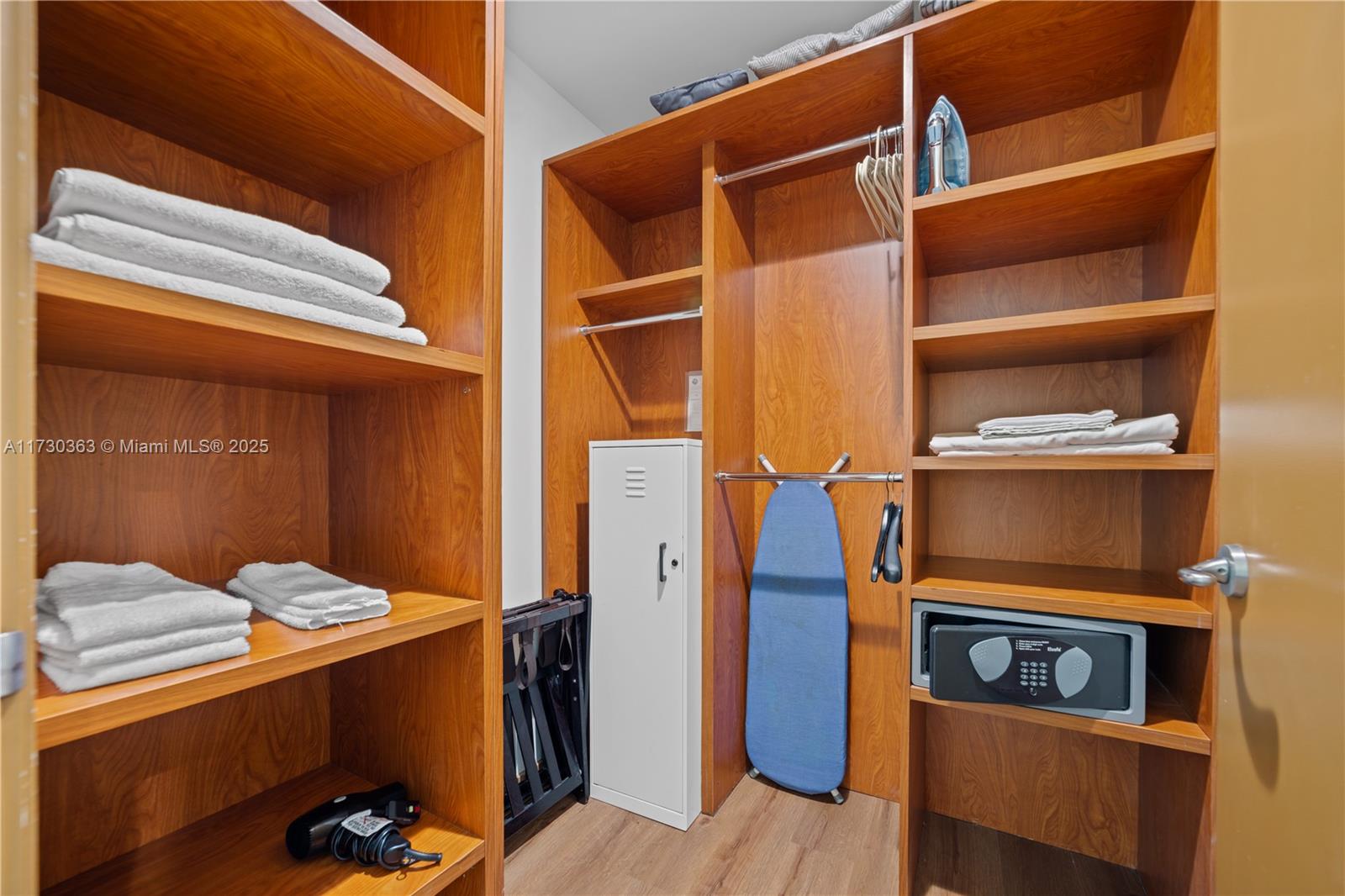 Brickell Miami, FL 33131 - Photo 19 of 19 a view of walk in closet with clothes and shoes