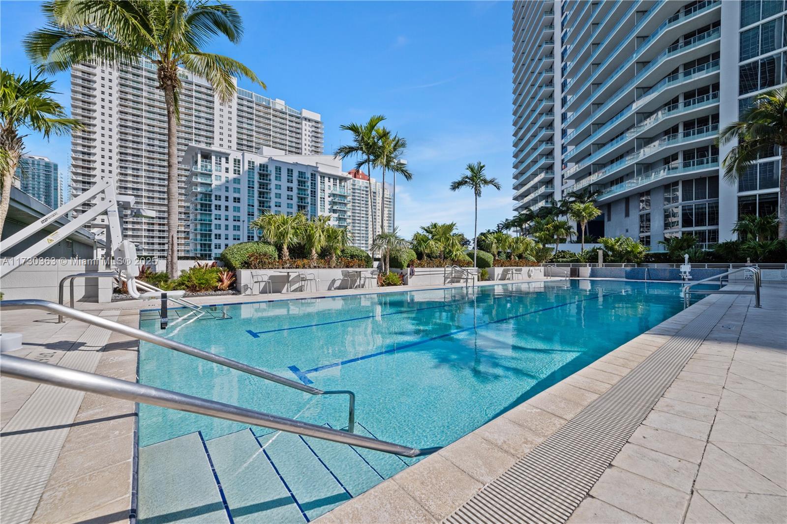 Brickell Miami, FL 33131 - Photo 7 of 19 a swimming pool with outdoor seating and yard