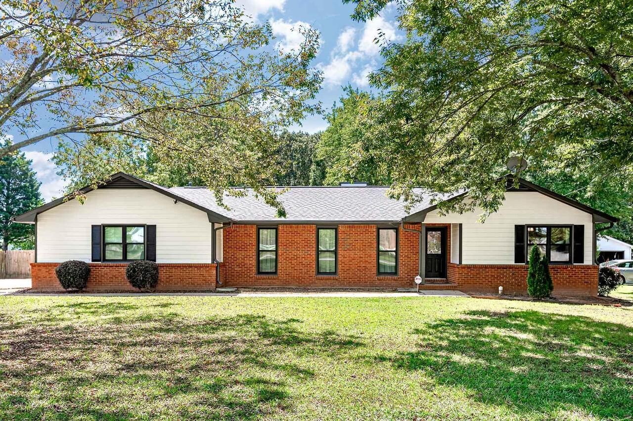 397 McCullough Road Stockbridge, GA 30281 - Photo 1 of 1 a front view of a house with a garden