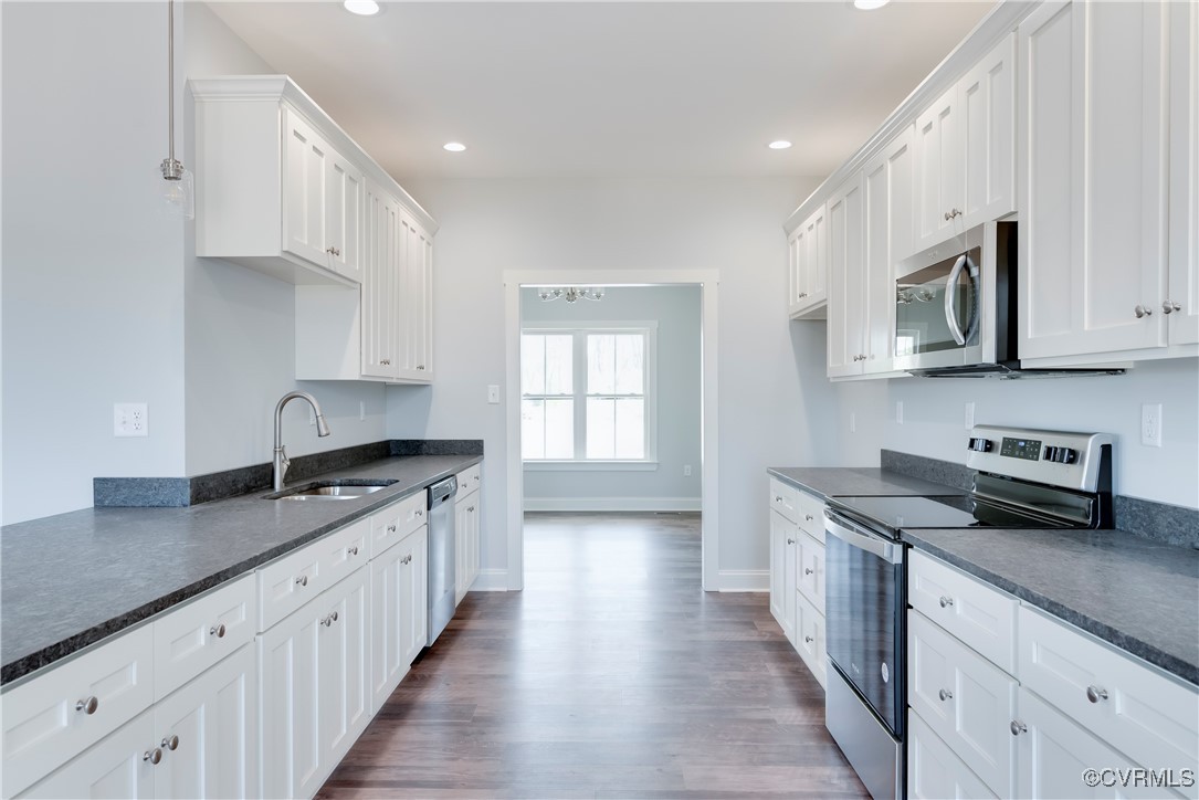 36 Highpockets Road Cartersville, VA 23027 - Photo 10 of 38 a kitchen with granite countertop a sink and cabinets