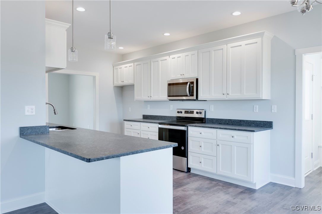 36 Highpockets Road Cartersville, VA 23027 - Photo 13 of 38 a kitchen with granite countertop white cabinets white stainless steel appliances and a sink