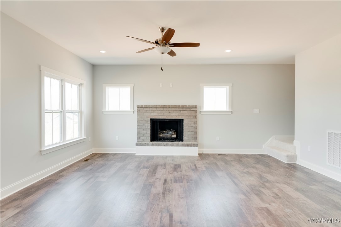 36 Highpockets Road Cartersville, VA 23027 - Photo 16 of 38 an empty room with windows and fireplace