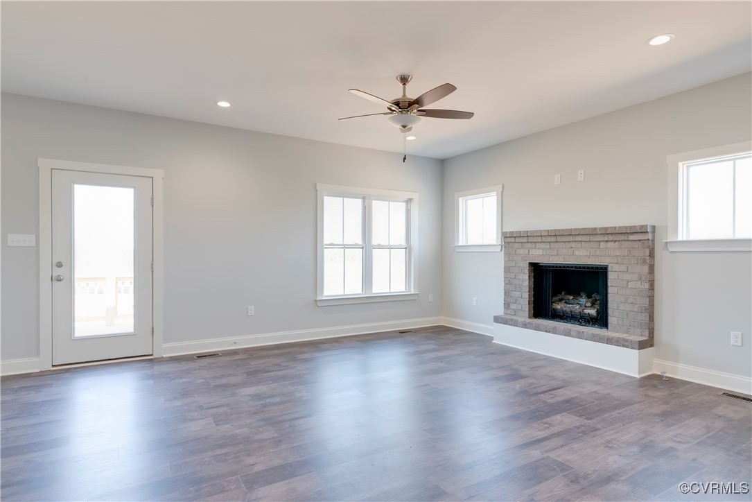 36 Highpockets Road Cartersville, VA 23027 - Photo 19 of 38 a view of an empty room with exposed radiator and fireplace