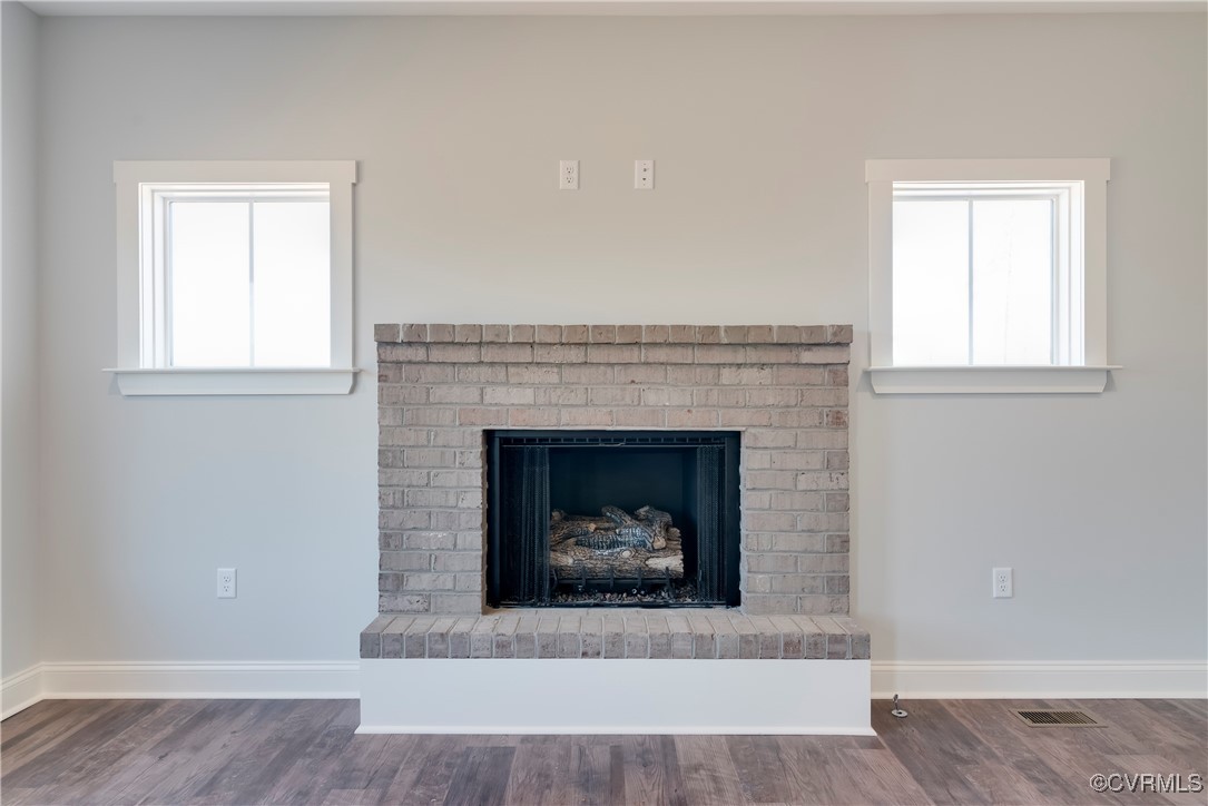 36 Highpockets Road Cartersville, VA 23027 - Photo 20 of 38 an empty room with a fireplace and window