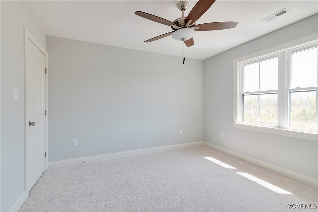 36 Highpockets Road Cartersville, VA 23027 - Photo 21 of 38 an empty room with a window and a fan