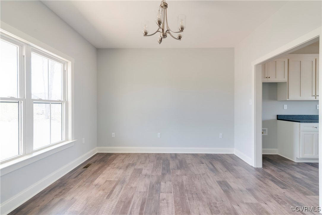 36 Highpockets Road Cartersville, VA 23027 - Photo 5 of 38 a view of a room with wooden floor and windows