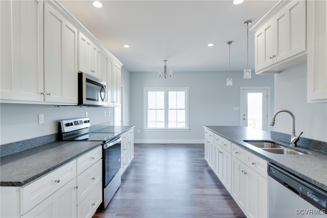 36 Highpockets Road Cartersville, VA 23027 - Photo 8 of 38 a kitchen with stainless steel appliances granite countertop a sink stove and cabinets