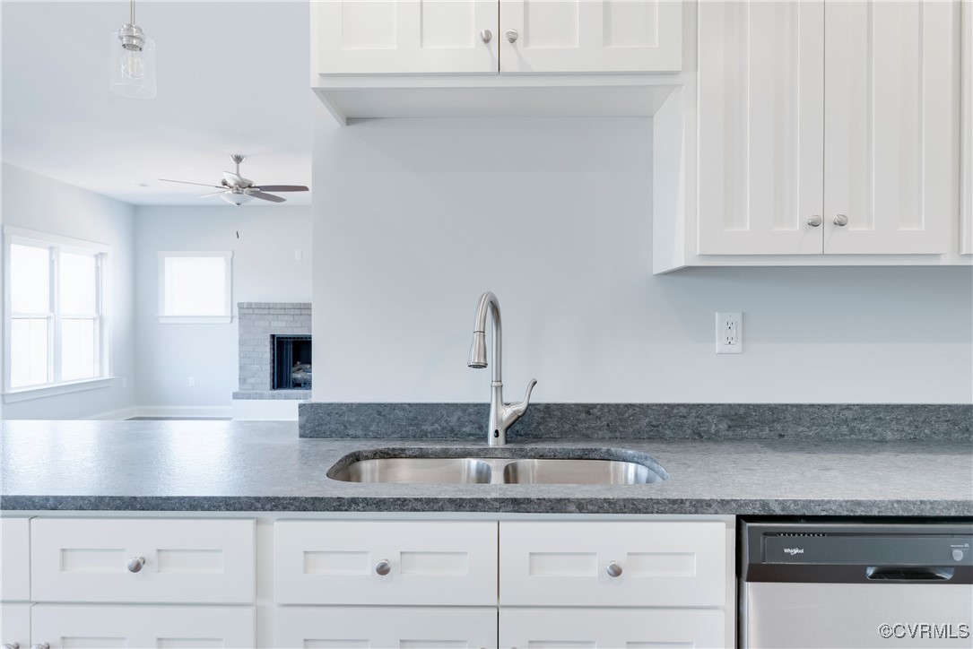 36 Highpockets Road Cartersville, VA 23027 - Photo 9 of 38 a kitchen with granite countertop a sink and cabinets