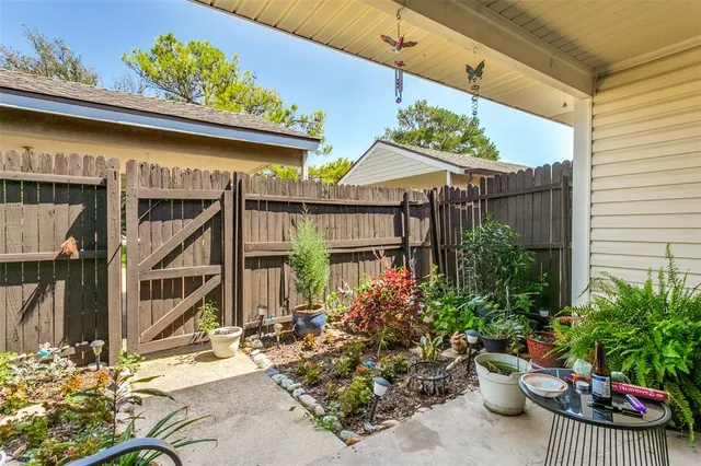 a potted plant sitting in front of a house
