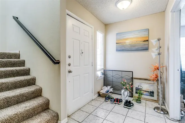 a living room with furniture and a painting