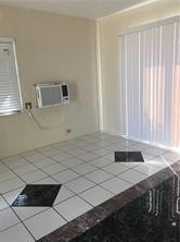 3313 Southeast 3rd Street Pompano Beach, FL 33062 - Photo 17 of 22 a bathroom with a sink and a mirror