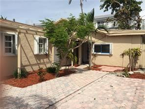 3313 Southeast 3rd Street Pompano Beach, FL 33062 - Photo 2 of 22 a front view of a house with a yard