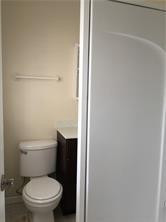 3313 Southeast 3rd Street Pompano Beach, FL 33062 - Photo 21 of 22 a white toilet sitting next to a shower