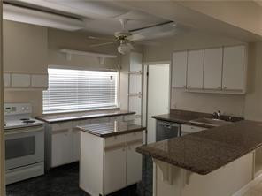 3313 Southeast 3rd Street Pompano Beach, FL 33062 - Photo 7 of 22 a kitchen with a sink stove and microwave