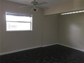 3313 Southeast 3rd Street Pompano Beach, FL 33062 - Photo 8 of 22 an empty room with a window
