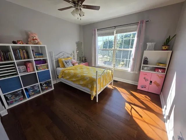 a bedroom with a bed furniture and a window