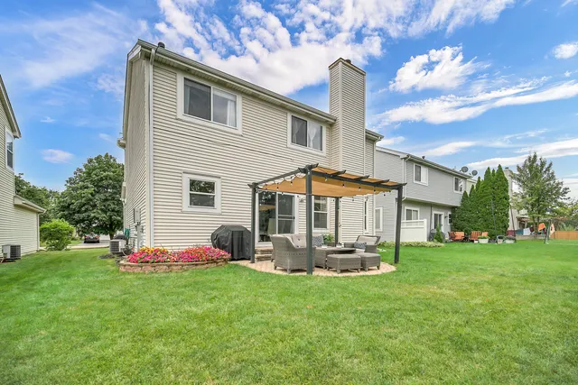 a view of a backyard with garden and plants