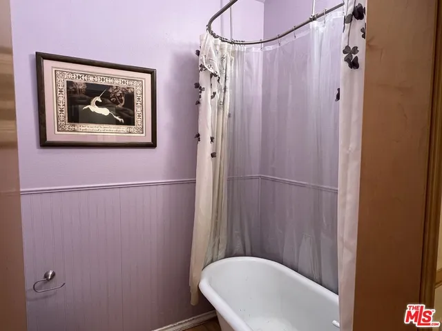 a bathroom with a shower and a toilet