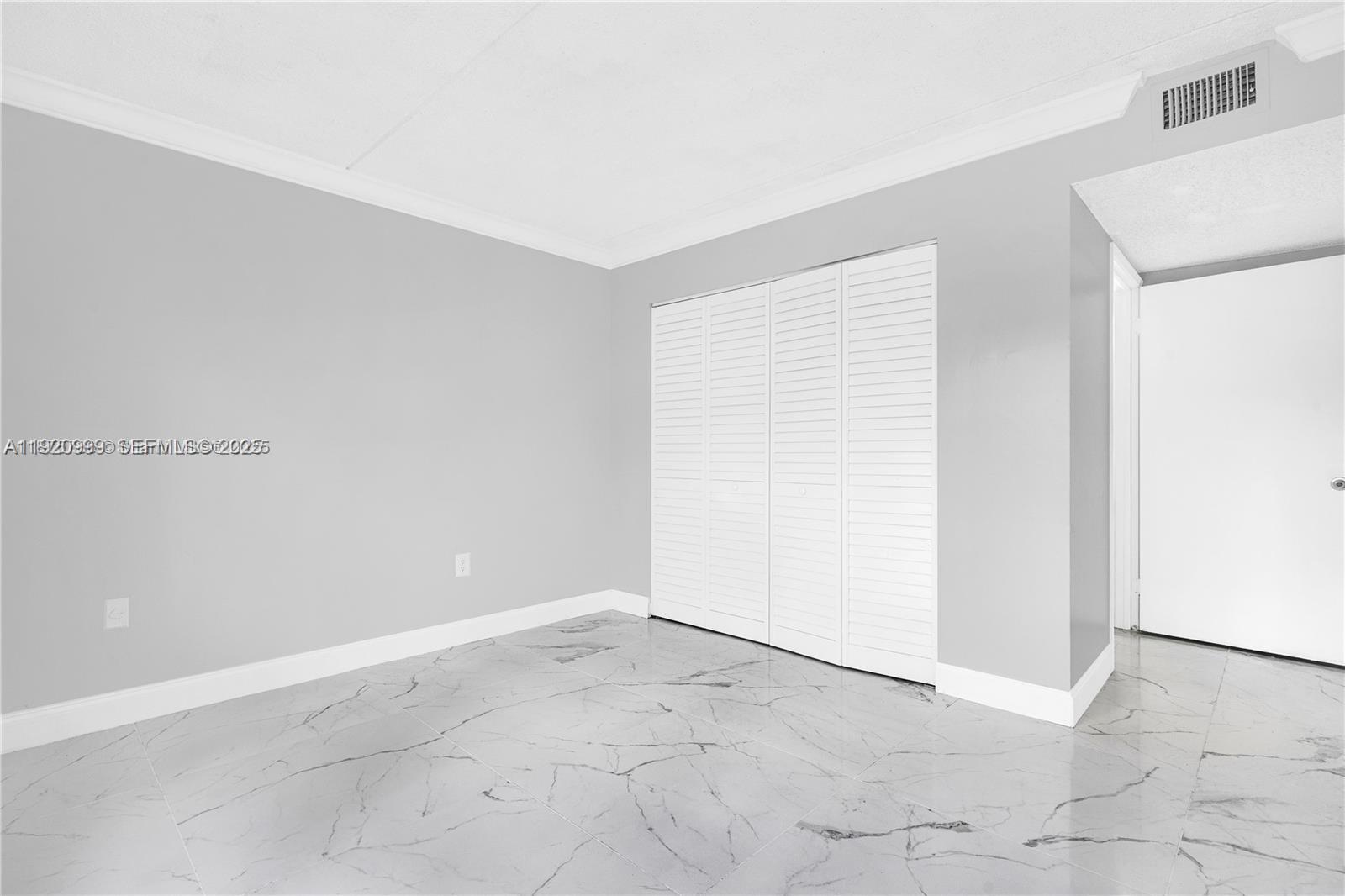 6135 Northwest 186th Street, Unit 202 Hialeah, FL 33015 - Photo 12 of 21 a view of an empty room